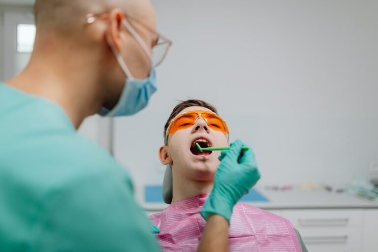 dentist checking the teeth of a Sinaporean patient